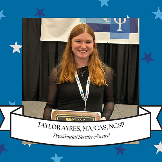 headshot of woman holding a plaque