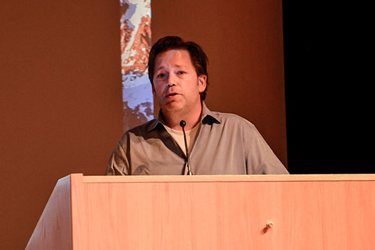 man talking at a podium
