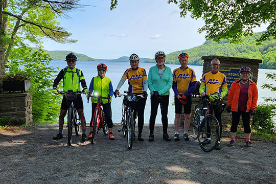 group of people on bicycles standing in a line