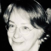 headshot of woman with glasses