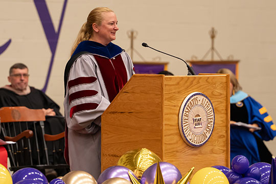 woman speaking at podium