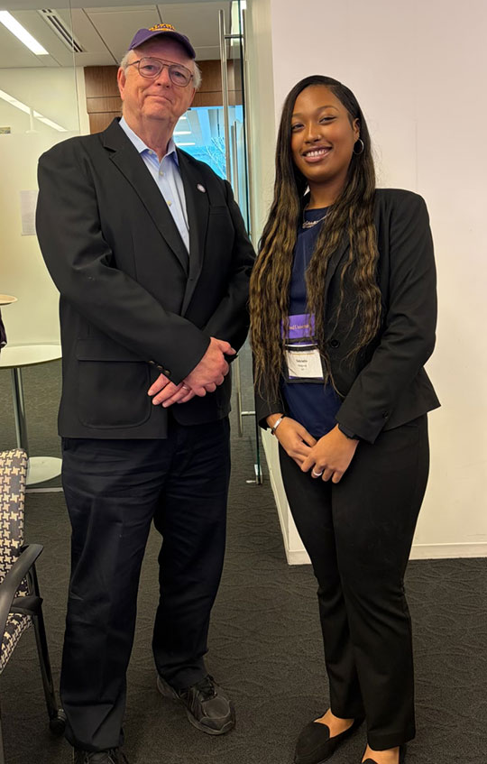man and woman standing next to each other