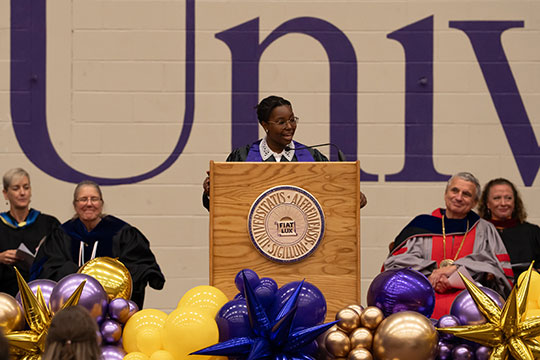 woman speaking at podium