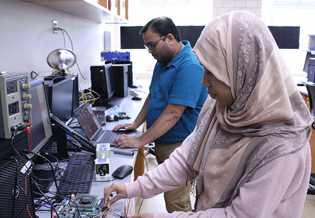 woman and man at computer stations