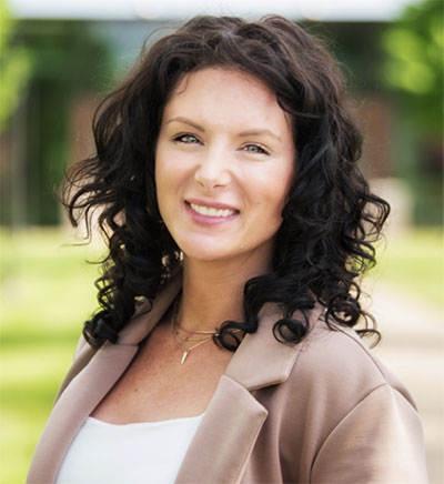 headshot of woman with long dark hair