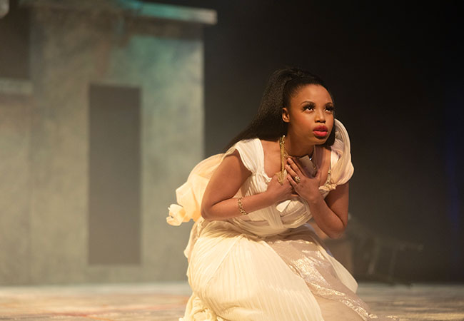 woman in dress on stage acting