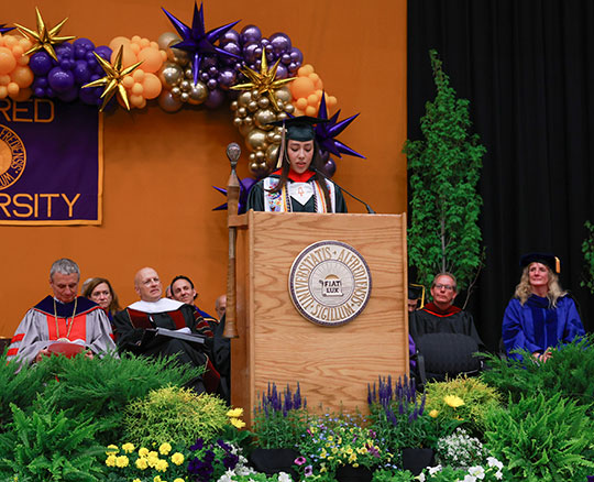 woman speaking at podium