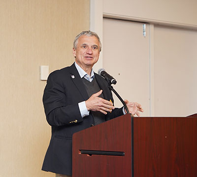 man sepaking at a podium