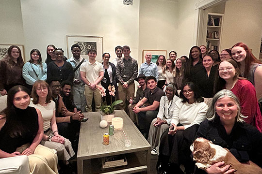 several people gathered in a living room