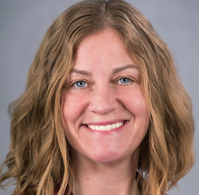 headshot of smiling woman with long hair