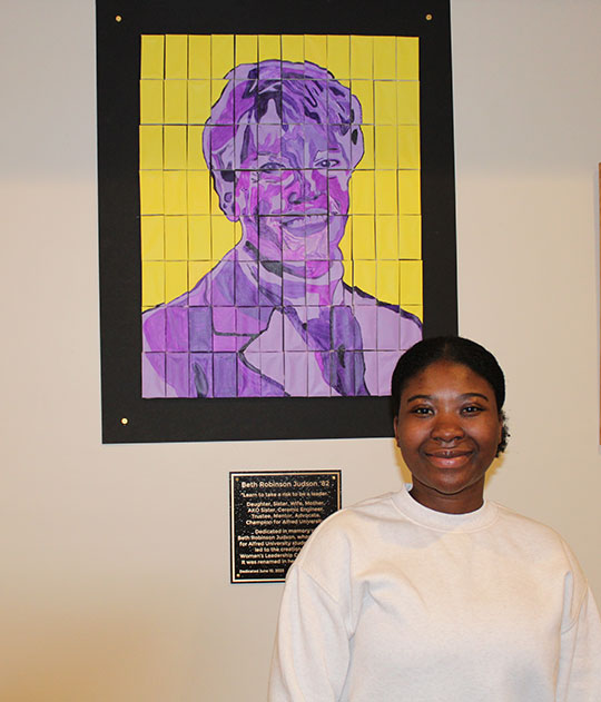 woman standing in front of a mosaic