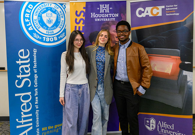 three people standing in a row