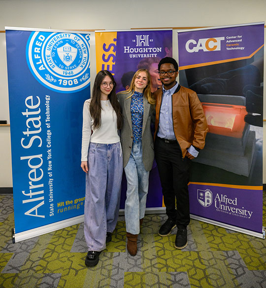 three people standing in a row