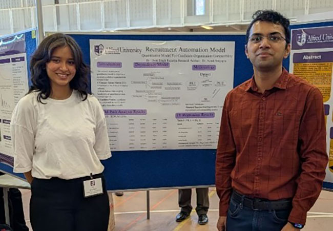 woman and man standing in front of a sign