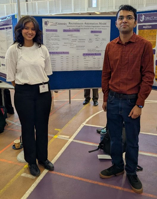 woman and man standing in front of a sign