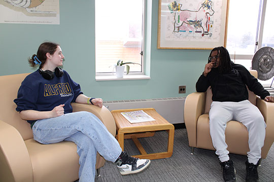 students sitting in cbairs talking