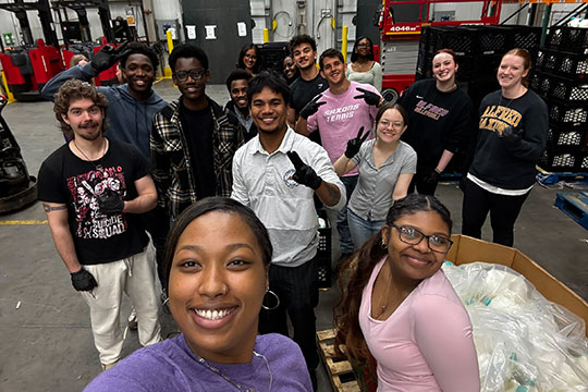 several people in a warehouse 