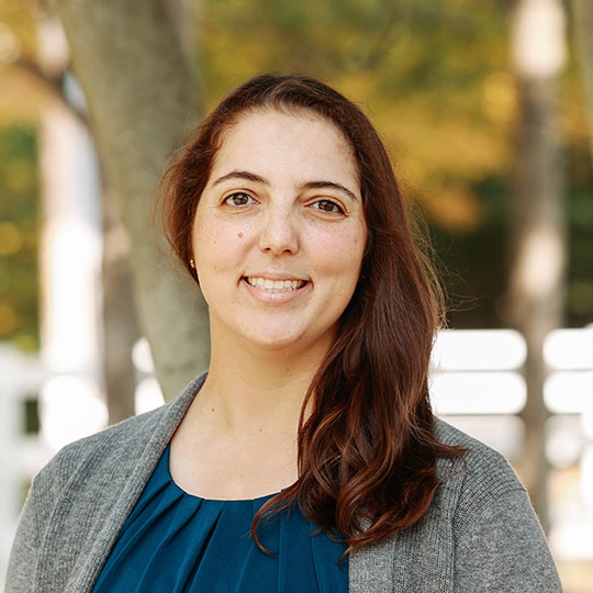 headshot of woman with long brown hair