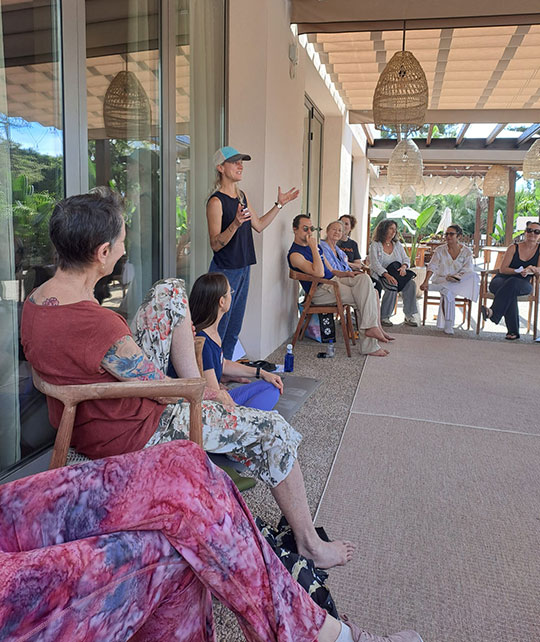 woman talking to a small group of people