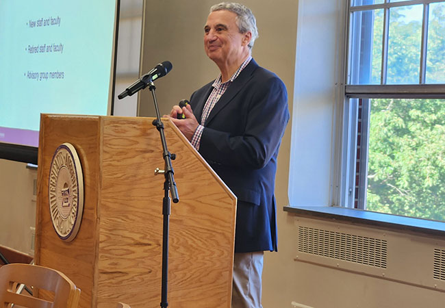 man standing at podium
