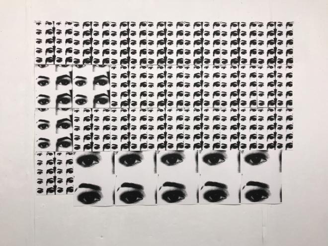 A print of eyes repeated in various sizes.  