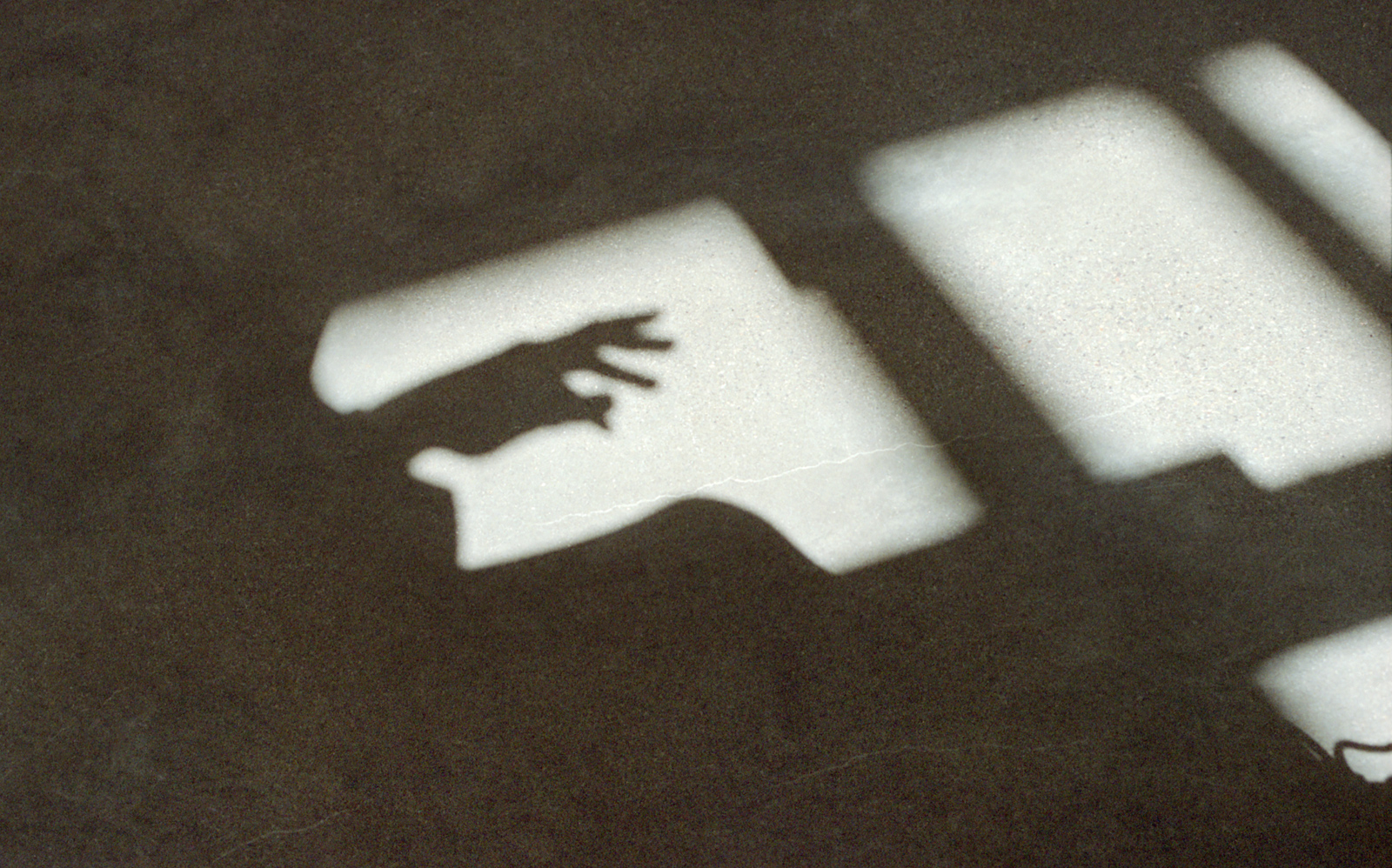 A shadow of a hand.