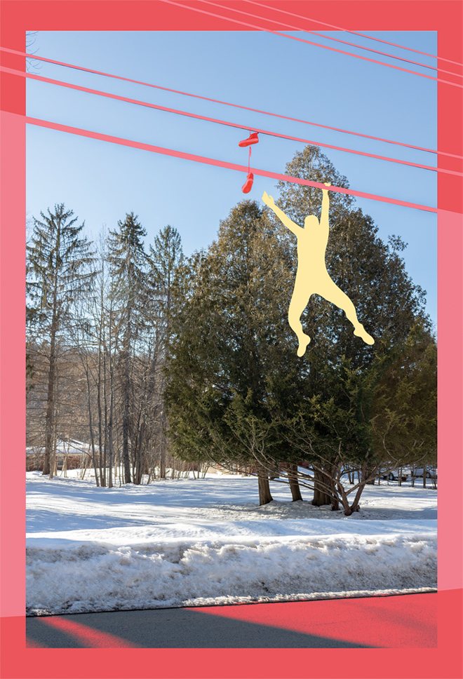 A photograph with vertical orientation of a field by the side of the road covered in snow with several evergreen trees. The image is framed by a border of two shades of pink and pink telephone cross the top of the image with a pink pair of shoes hanging from the bottom wire. Alight yellow figure hangs from one hand off the bottom wire with the other hand reaching for the shoes.