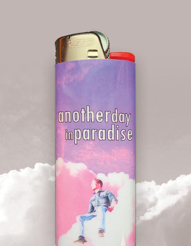 Cigarette lighter wrapped with a man sitting on pink clouds. 