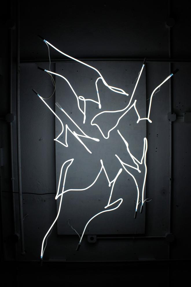 White Neon Organic Shapes Light are Hung From The Ceiling.
