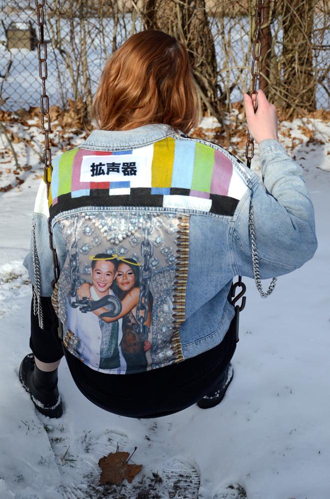Denim jacket with heat pressed patch, painted TV color bars, and metal chains 