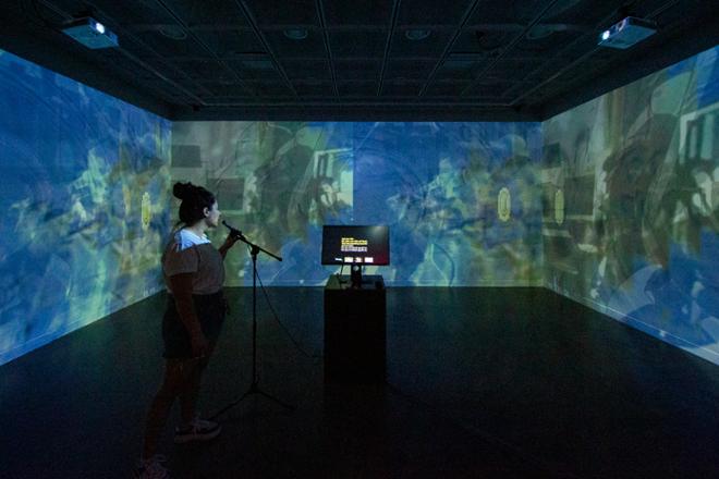 Image of performer interacting with Image Karaoke a fully interactive audio/visual installation. 