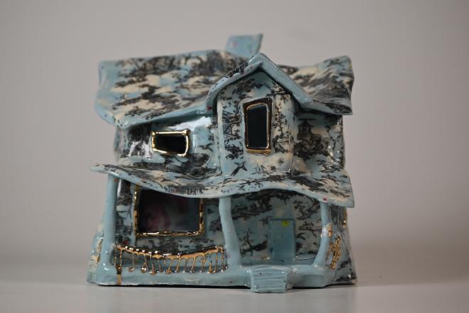 Blue distorted ceramic house, with fabric shengyou print decal, and gold luster accents.