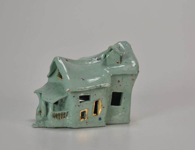 Distorted green ceramic  house, with multi colored confetti grog and gold luster accents.