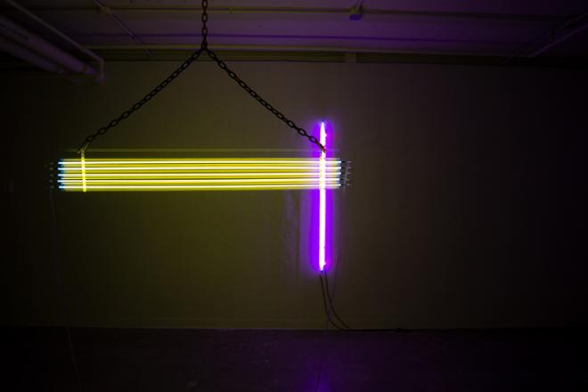 Installation view of Yellow, Yellow, Yellow, Yellow, Yellow and Magenta Raspberry. The room is mostly filled with yellow light with a hint of purple light coming from Magenta Raspberry. 