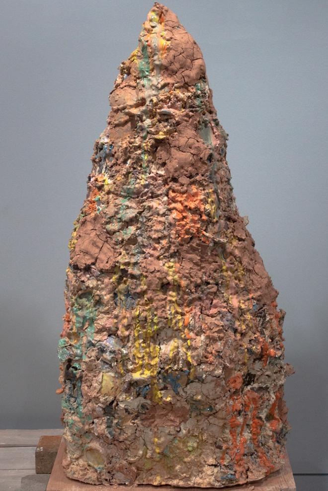Almost six foot ceramic cone made from recycled ceramics, covered in bright multi colored glazes and washed with raw clay. Sitting on an hexagonal wooden stand well playing a sound that uses speeches, poems, and nostalgic noises structured together.  