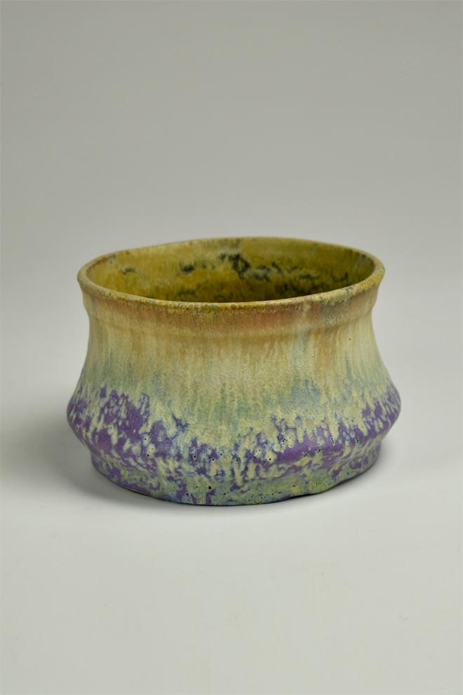 Small, deep bowl with narrow mouth and a wide base