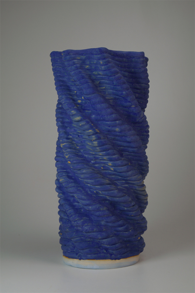 Twisted, coil built matte blue glazed vessel.  