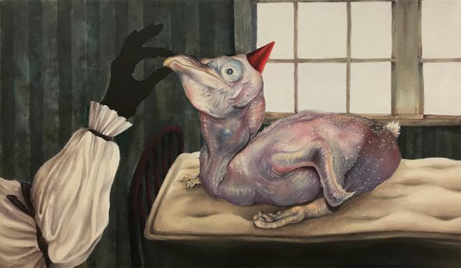 A baby pelican with a small, red dunce cap sits on a yellowed mattress in front of a bright window. The pelican’s beak is being held shut by a pierrot’s hand.