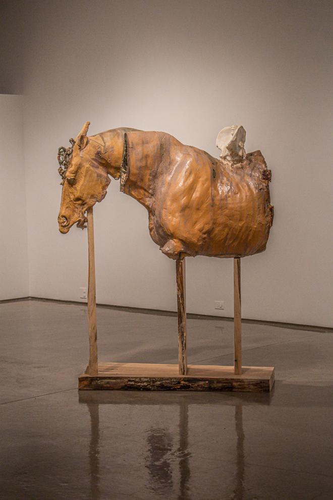 Horse sculpture elevated with maple wood  
