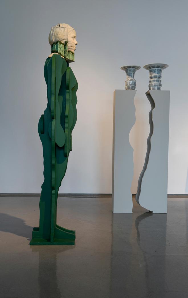 Alt text: A ceramic printed bust of the artist sits atop a pedestal in the form of her body. Two vases in the background create the negative space profile of her face, atop two pedestals creating the negative space of her body. 