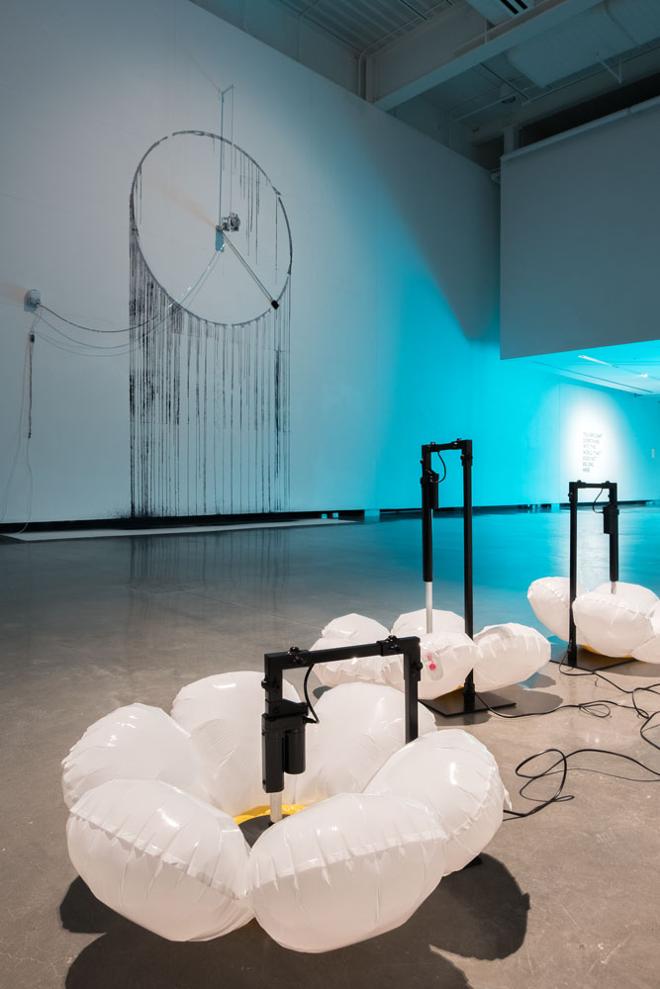 Photograph from a Thesis Exhibition by a 2023 MFA graduate Tomáš Penc featuring an installation view of his kinetic sculptures Night is a Day That Fell Short and (Perpetual) Death of Lucretia.