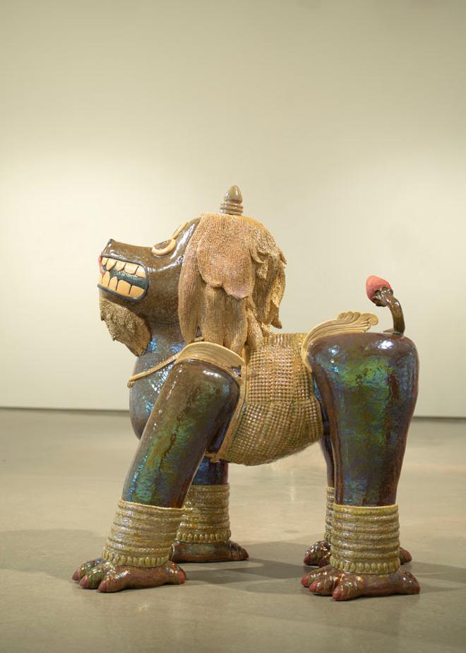 A large, dog-like ceramic sculpture. 