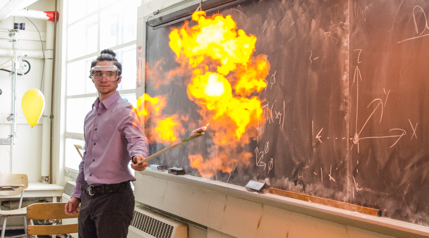 Student in chemistry class creating flames in an experiment