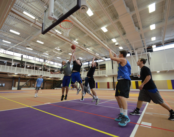 Student athletes in the gymnasium playing basketball
