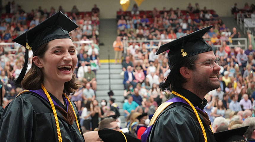 students at graduation wearing their caps and gowns