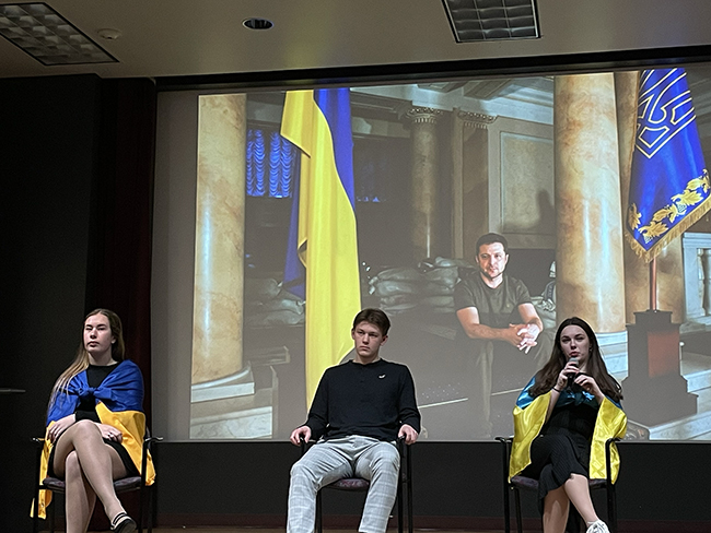 A photo of Alina Zabihailo and two students during a Ukrainian Student Association meeting
