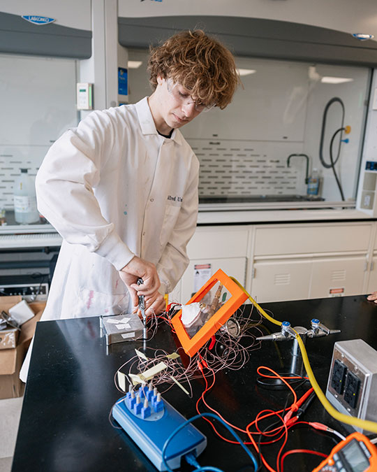 David Howe working on mechanical engineering senior capstone, heat sink