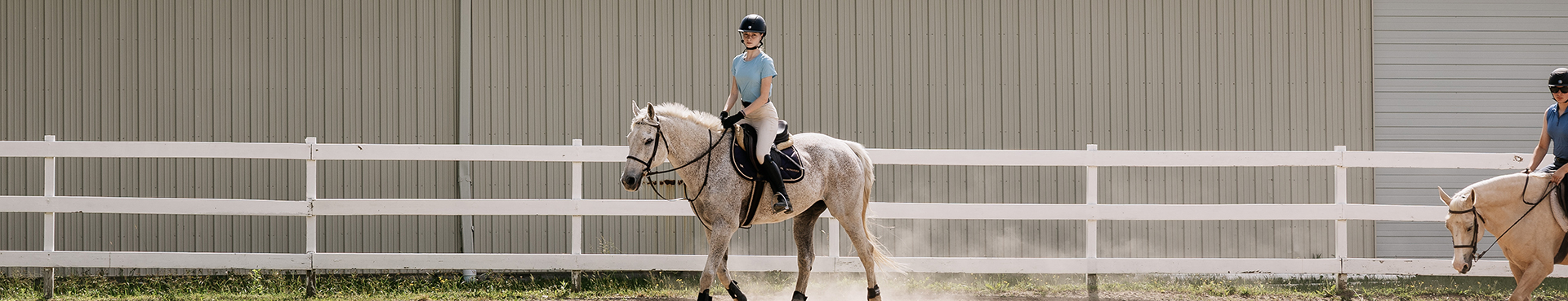A photo of an Alfred University student riding a horse