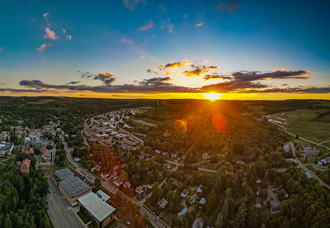 A drone photo of a sunset over Alfred New York