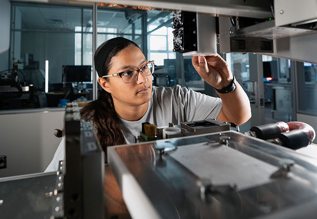 A photo of Kiani Barnard-Pratt working in an engineering lab